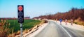 Semaphore traffic light signalization during road maintenance, red stoplight for traffic regulation Royalty Free Stock Photo