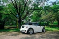 modified white Mini Cooper S parked under the tree on outdoor car meet Royalty Free Stock Photo