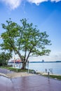 Trees, beach and Jetty in front of the Beaulieu House in Sembawang Park, Singapore.