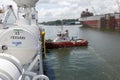 Sembawang, Singapore - FEB 27 2013: Pacific Worboats tugboat PW Tenaga assisting arriving ship