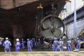 Sembawang, Singapore - Mar 2 2013: Sembawang ship yard workers changing stern nozzle azipod thrusters for offshore vessel using se