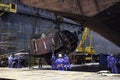 Sembawang, Singapore - Mar 2 2013: Sembawang ship yard workers changing stern nozzle thrusters for offshore vessel