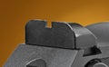 Pistol rear sight on a brown background Royalty Free Stock Photo