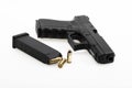 Semi automatic pistol handgun and magazine with bullets on white background Royalty Free Stock Photo