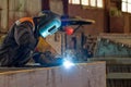 Semi-automatic welding of metal structures in the shop Royalty Free Stock Photo