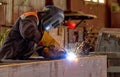 Semi-automatic welding of metal structures in the shop Royalty Free Stock Photo