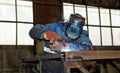 Semi-automatic welding of metal structures in the shop Royalty Free Stock Photo