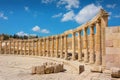 Semi-circle of columns forming a plaza at the ancient ruins