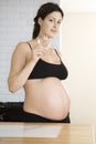 Semi Dressed Pregnant Woman Drinking Water Royalty Free Stock Photo