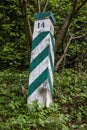 Semi fallen wooden border pillar in national park Skolivski beskidy, Lviv region, Ukraine