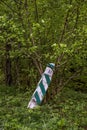 Semi fallen wooden border pillar in national park Skolivski beskidy, Lviv region, Ukraine