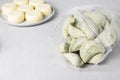 Semi-finished frozen raw vareniki, vegetarian dumplings with spinach and cottage cheese in zip bag on white background Royalty Free Stock Photo