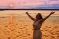 Semi Silhouette of Woman Raising Hands at Ocean