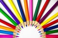 semi-sircle of colored pencils on white background Royalty Free Stock Photo