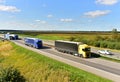 Semi-trailer truck DAF driving along highway. Truck convoy or caravan of trucks delivery goods by roads. Services and Transport Royalty Free Stock Photo