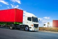 Semi Trailer Truck Driving on Highway Road. Shipping Container Trucks. Freight Trucks Logistics Cargo Transport Royalty Free Stock Photo