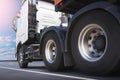 Semi Trailer Truck Driving on Highway Road. Truck Wheels Spining. Industry Road Freight Truck. Logistic and Cargo Transport. Royalty Free Stock Photo