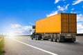 Semi Trailer Truck Driving on The Road with Blue Sky. Shipping Cargo Container, Freight Truck Logistic. Royalty Free Stock Photo