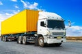 Semi Trailer Truck Driving on The Road with Blue Sky. Shipping Cargo Container, Freight Truck Logistic. Royalty Free Stock Photo