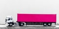 Semi trailer truck lorry cargo vehicle on road background, White semi truck with pink container cargo