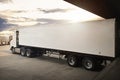 Semi Trailer Trucks Parked Loading at Dock Warehouse. Shipping Cargo Container Delivery Trucks. Logistics Freight Truck Royalty Free Stock Photo