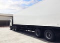 Semi Trailer Trucks the Parking at Distribution Warehouse. Delivery Trucks. Shipping Cargo Container. Lorry Loading. Freight Royalty Free Stock Photo