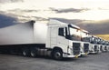 Semi Trailer Trucks The Parking Lot with Sunset Sky. Diesel Truck. Shipping Container Freight Trucks. Lorry Trucks Logistics Cargo Royalty Free Stock Photo