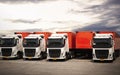 Semi TrailerTrucks Parked Lot with The Sunset Sky. Shipping Container. Delivery Transit. Diesel Trucks. Freight Trucks Logistics. Royalty Free Stock Photo