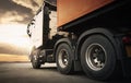 Semi TrailerTrucks Parked with The Sunset Sky. Shipping Container. Engine Diesel Trucks. Lorry Tractor. Freight Trucks Logistics. Royalty Free Stock Photo