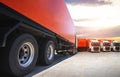 Semi TrailerTrucks on Parking with The Sunset Sky. Shipping Container. Trucking. Truck Wheels Tire. Delivery Transit. Diesel Truck Royalty Free Stock Photo