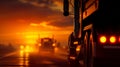 A semi truck driving down a road at sunset Royalty Free Stock Photo