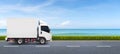 The semi-truck  is driving on a two-way beach road. Royalty Free Stock Photo