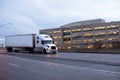 Semi truck with dry van trailer on evening road Royalty Free Stock Photo