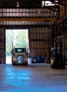 Semi truck entering old antic building warehouse unloading cargo Royalty Free Stock Photo