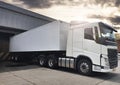 Semi Truck Parked Loading at Dock Warehouse. Cargo Shipment. Industry Freight Truck Transportation. Shipping Warehouse Logistics. Royalty Free Stock Photo