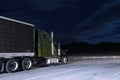 Semi-truck on parking lot in night moonlight