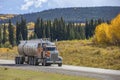 Semi truck with trailer driving on highway Royalty Free Stock Photo