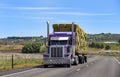 Semi truck with trailer driving on highway Royalty Free Stock Photo