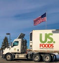 Semi truck and trailer for US Foods and American flag in background