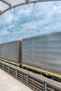 Semi-truck trailers with tarp cover on the bridge Royalty Free Stock Photo