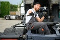 Semi Truck Under Maintenance. Caucasian Truck Mechanic Working to Fix the Tractor. Royalty Free Stock Photo