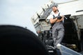 Semi Truck Under Maintenance. Caucasian Truck Mechanic Working to Fix the Tractor. Royalty Free Stock Photo