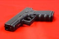 Semiauto handgun on red background