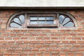 Semicircular window on brick wall Royalty Free Stock Photo