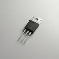 A semiconductor transistor, possibly of the TO-220 package type, features a black Royalty Free Stock Photo