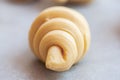 Semifinished or unbaked croissant on a baking sheet. Puff pastry baking. Close up Royalty Free Stock Photo