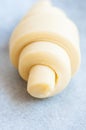 Semifinished or unbaked croissant on a baking sheet. Puff pastry baking Royalty Free Stock Photo