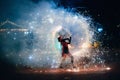 SEMIGORYE, IVANOVO OBLAST, RUSSIA - JUNE 26, 2018: Fire show. Girl spins fiery sparkling torches