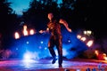 SEMIGORYE, RUSSIA - JUNE 17, 2022: Fire show at night at festival event. Man with torches arranges a pyrotechnic Royalty Free Stock Photo