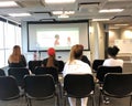 A seminar room with attendees learning about achieving success by mastering adaptive resilience to overcome setbacks